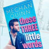 a hand holding the book "Those Three Little Words" by Meghan Quinn
