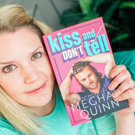selfie of Meghan Quinn holding her book "Kiss and Don't Tell"